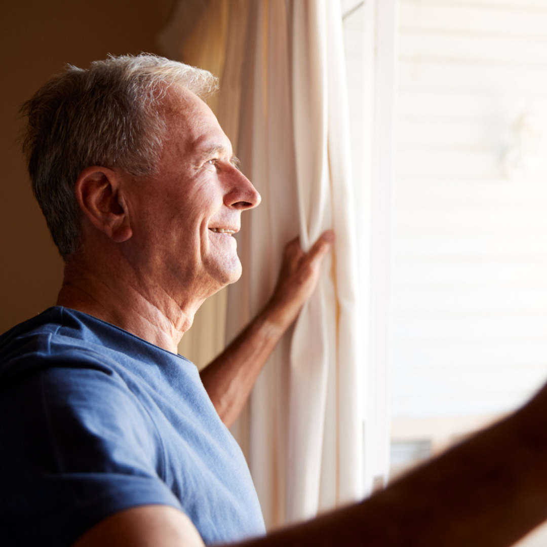 overnight relief from dry eyes - older man wakes up in the morning with refreshed eyes 