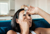 30+ Lady applying clinitas eye drops to relieve her dry eyes