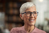 Older lady looking pleased after applying clinitas dry eye drops